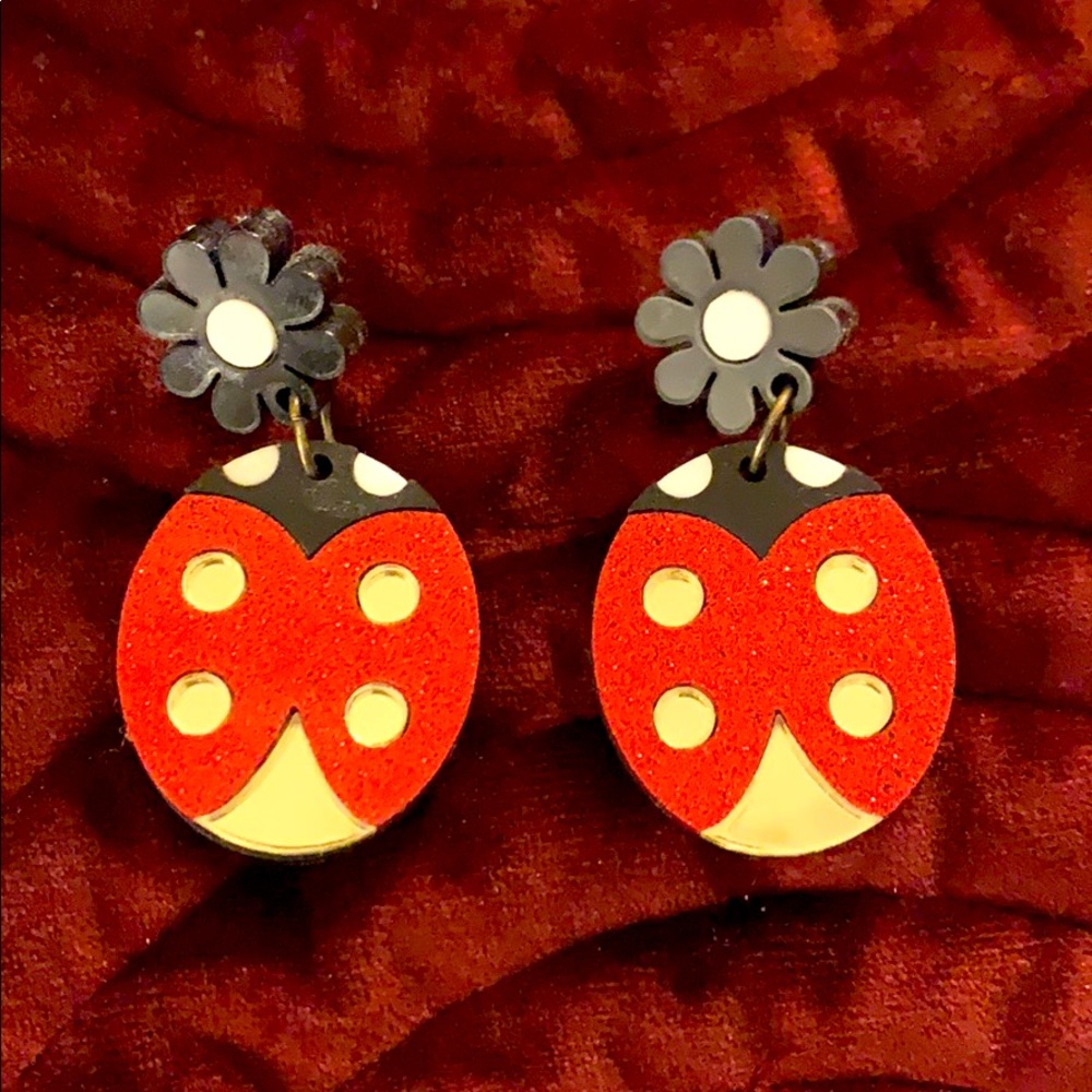 Revere Folie acrylic lady bug earrings.
